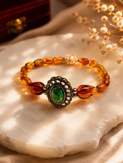Vintage Style Amber Bead Bracelet With Green Cabochon Centrepiece