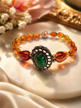 Vintage Style Amber Bead Bracelet With Green Cabochon Centrepiece