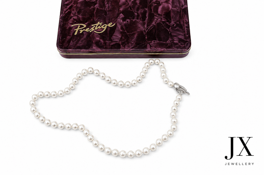 VINTAGE Single Strand Pearl Necklace by Prestige Jersey Pearls, with 9ct gold knotted clasp. In fitted box with outer cover.